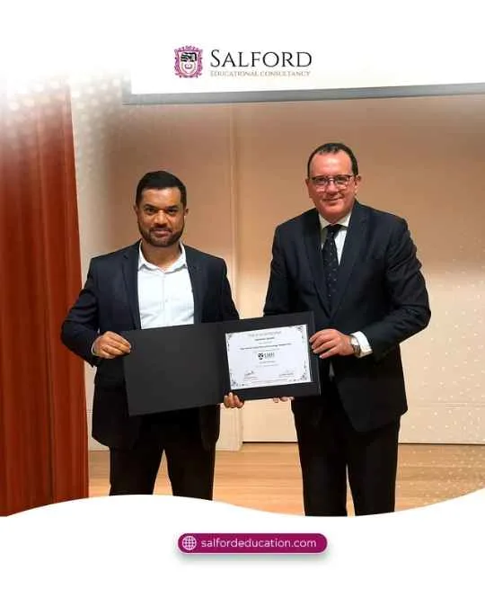 Participant receiving a certificate at the Oxford Leadership Masterclass organised by Salford Education