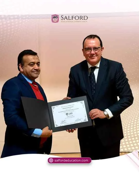 Participant receiving recognition at the Oxford Leadership Masterclass